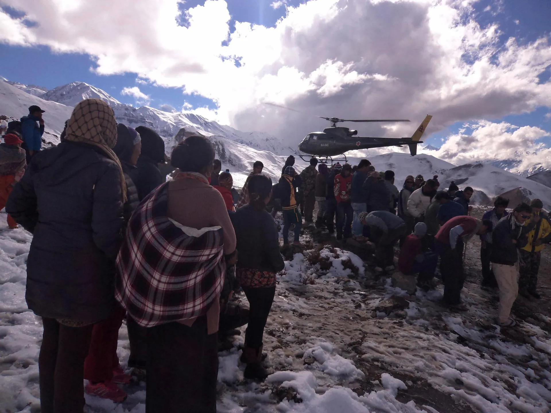 Trekkers escape a heavy blizzard generate by the tail end of Cyclone Hudhud.